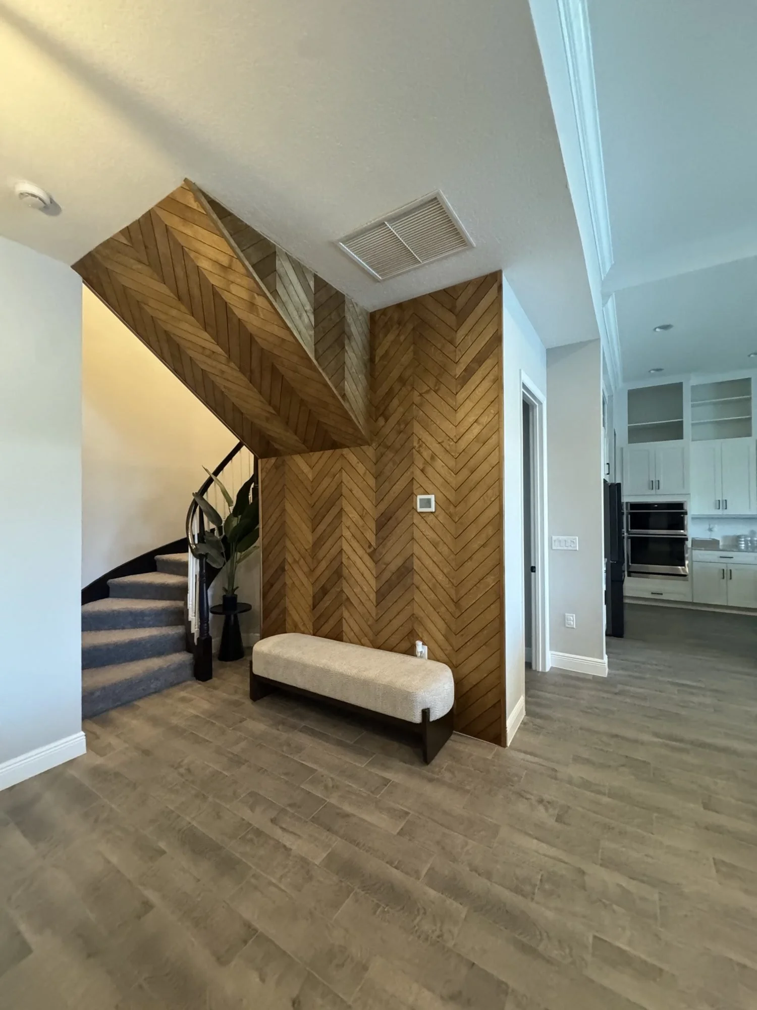 Chevron accent wall along stairs