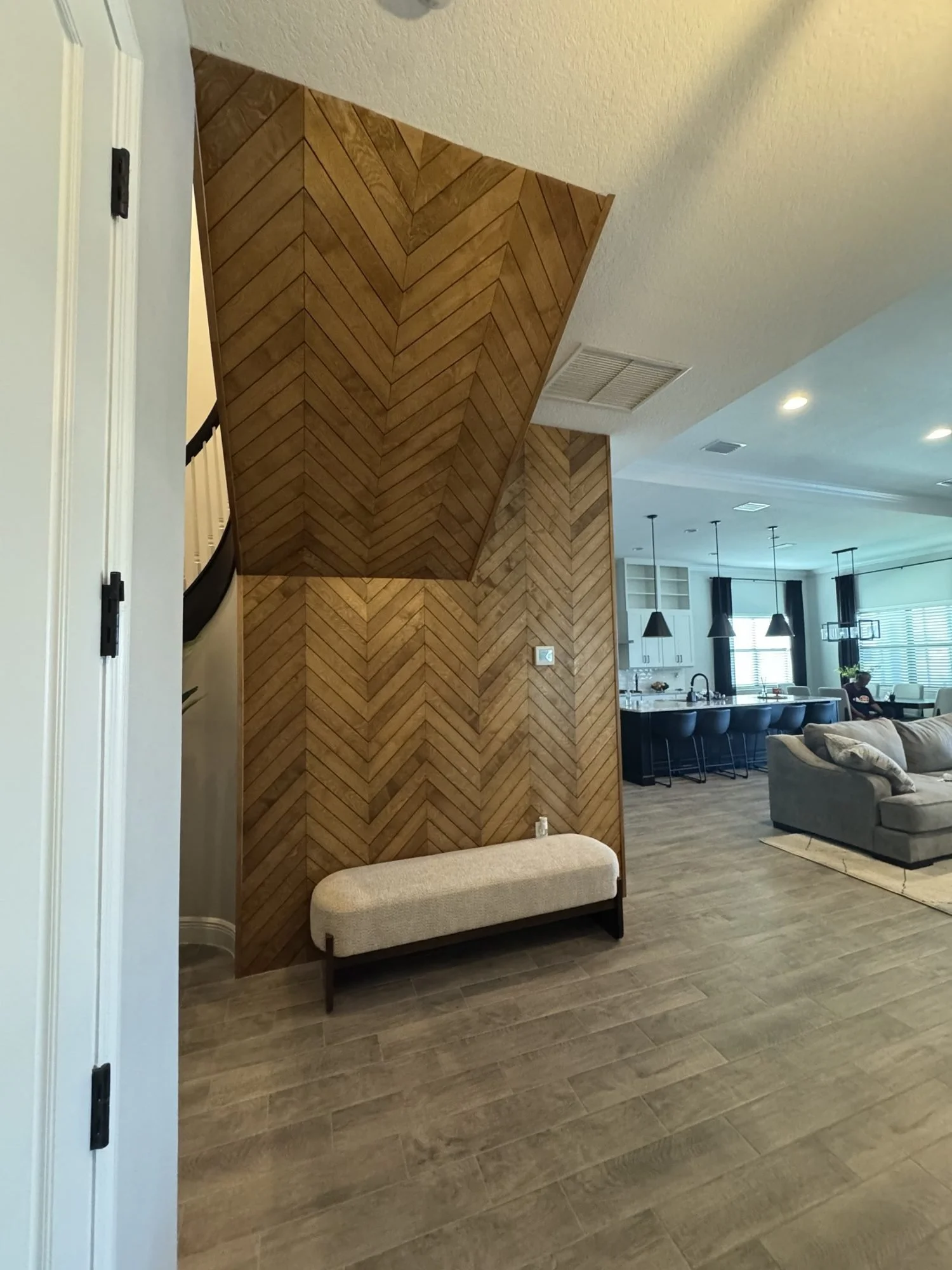 Chevron accent wall along stairs