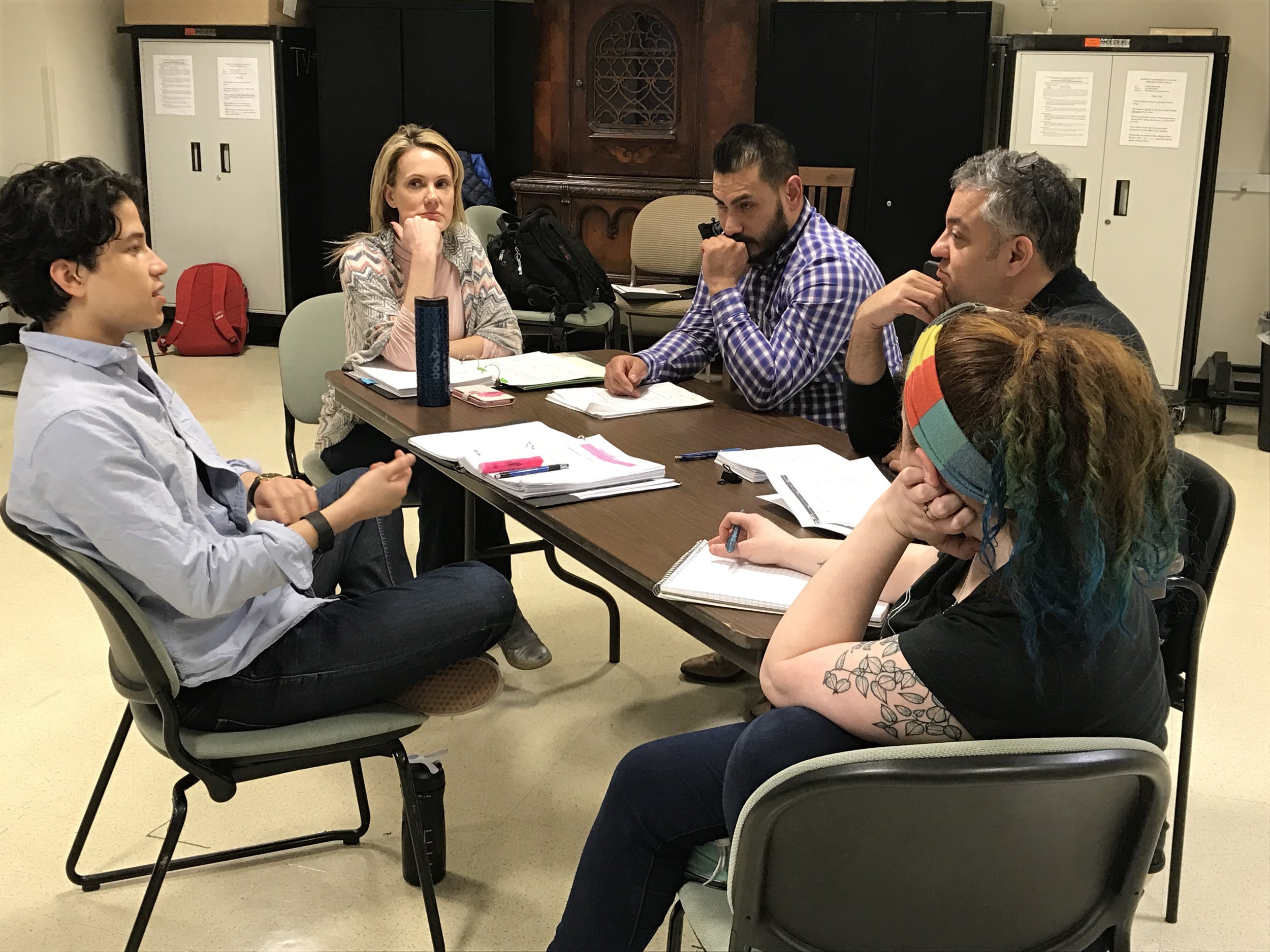 Director Rachel Iannantuoni discusses the play with colleagues (Photo/Diamond Stoklin)