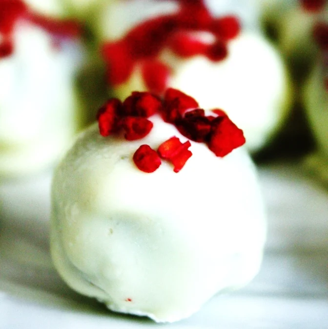 Raspberry dusted white chocolate coated salted caramel truffles