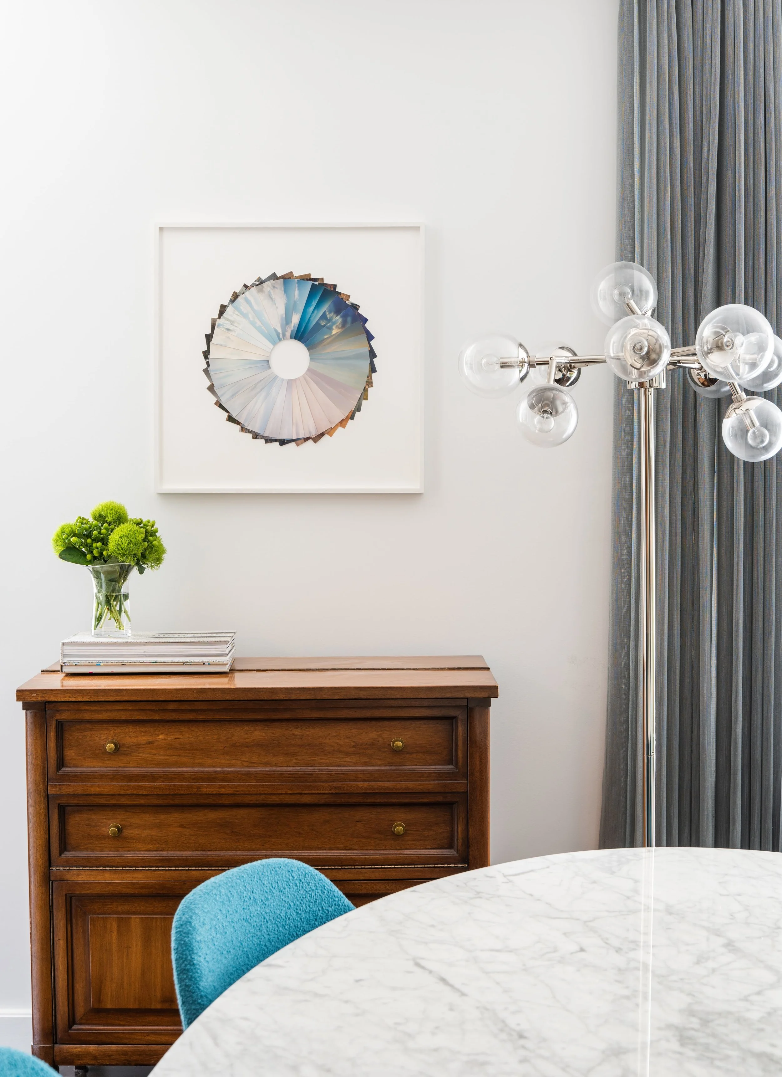 Andres Galeano’s collaged photos adds a sophisticated conversation piece to the dining room.