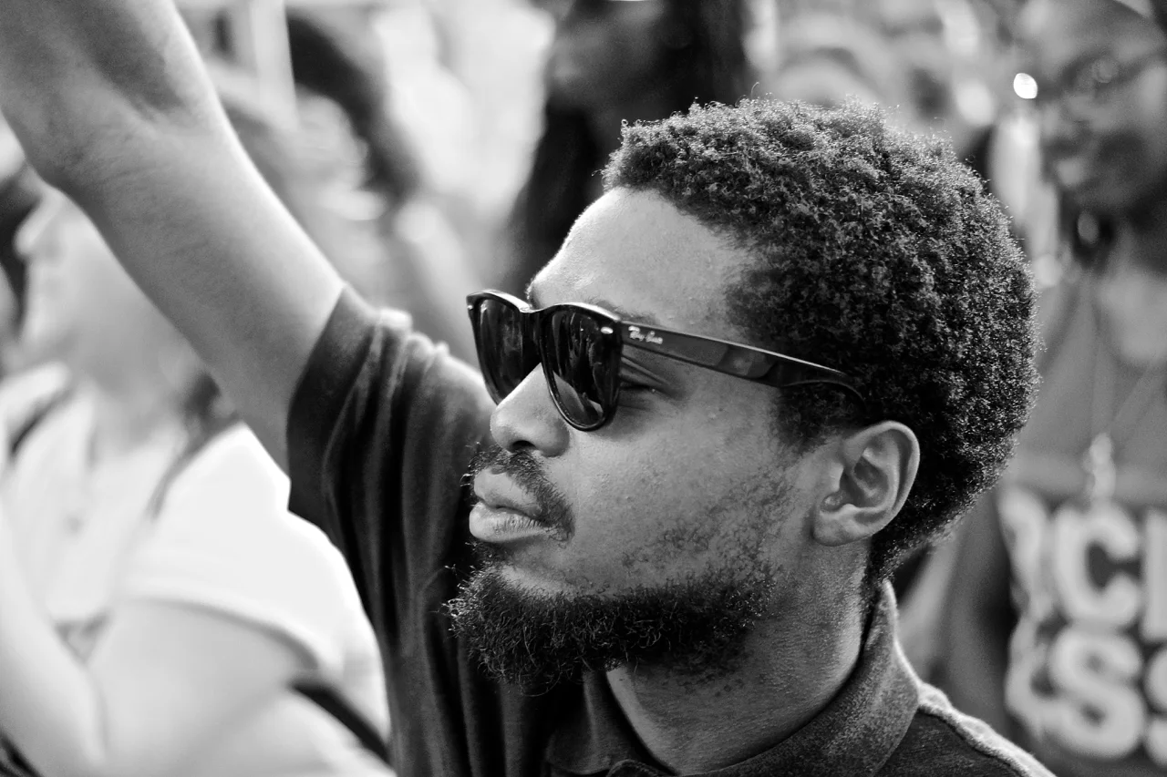 A young man intently listens during a July 15, 2016, Black Lives Matter rally at the Texas Capitol in Austin. The rally protested police brutality against black men and all people of color.