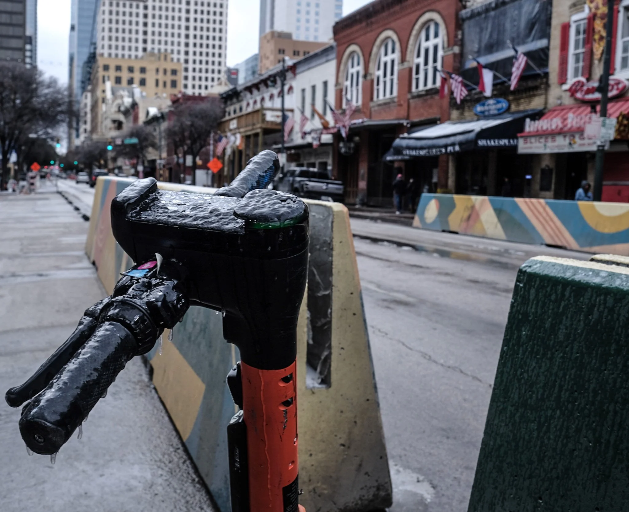  Iced-over electric scooter on Sixth Street, January 25, 2026. 