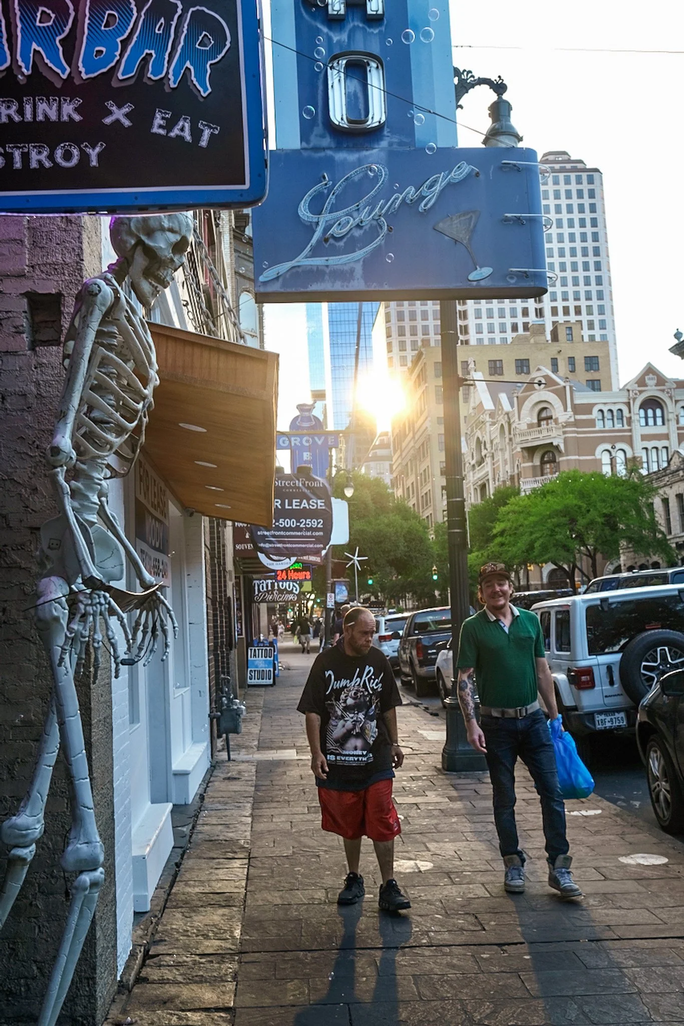 August 8, 2026: Casper, at left, walking with a friend on Sixth Street.