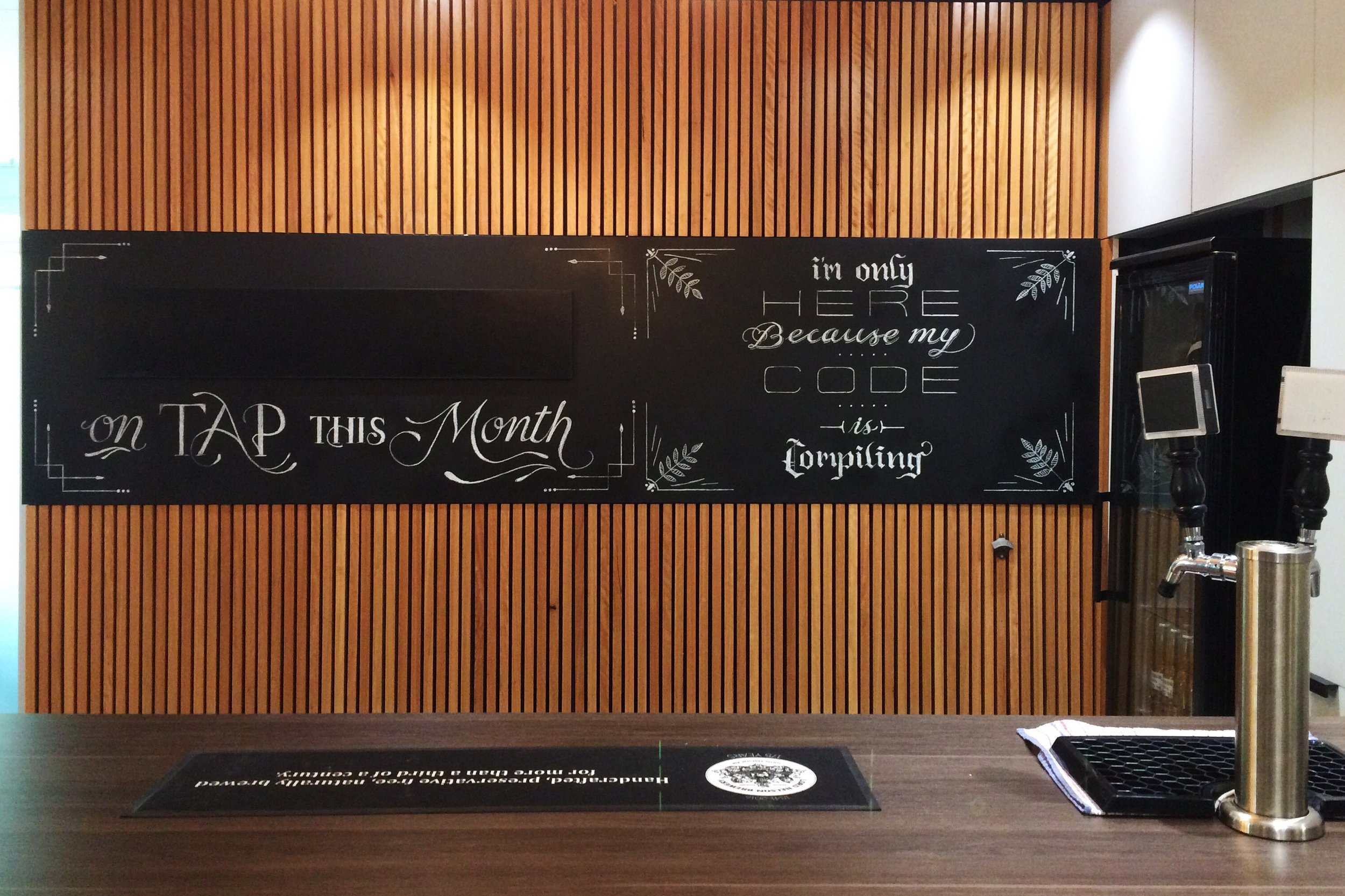 The finished piece. Full bar with custom chalk lettering.