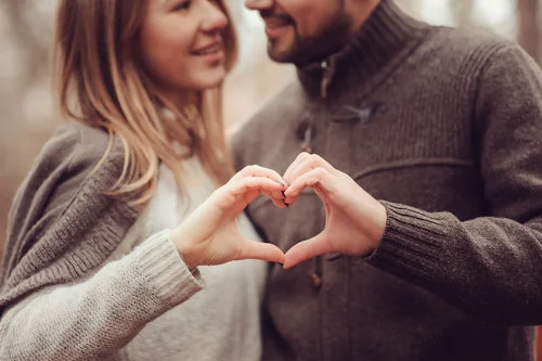 bigstock-young-happy-loving-couple-show-109395056.jpg