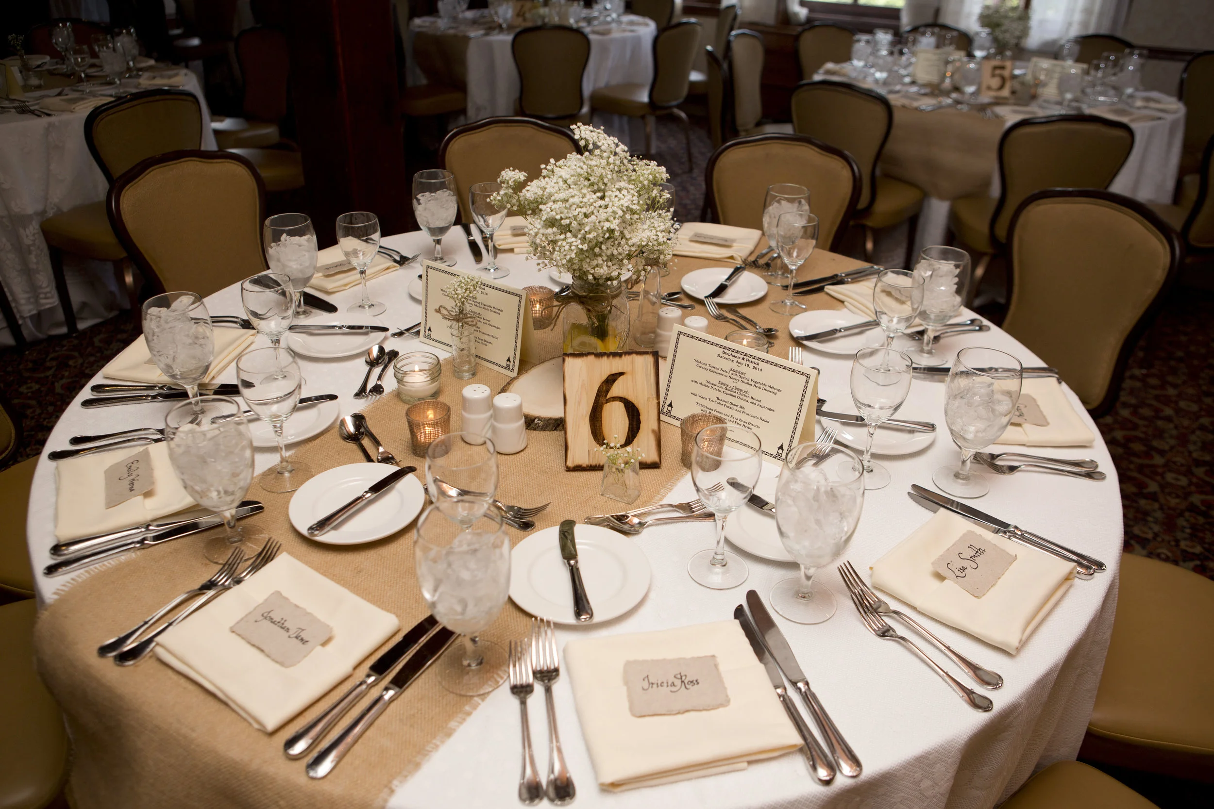 Those beautiful bunches of baby's breath with lemon vases AND the place cards? The venue wouldn't touch them. But, thankfully, the wedding coordinator was happy to step up and take care of these very important details! (photo courtesy of Jennifer Seay Photography )
