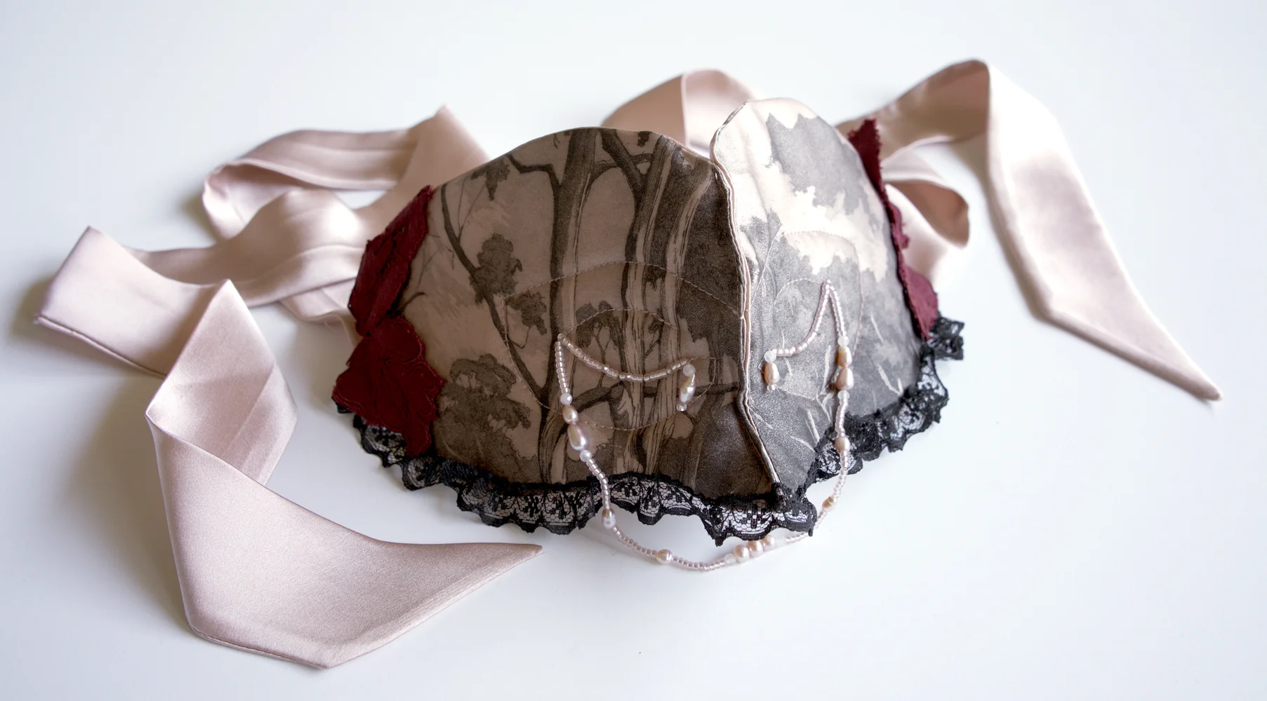 Seductive Delusion, 2019, etching on silk with lace applique and glass and pearl beading