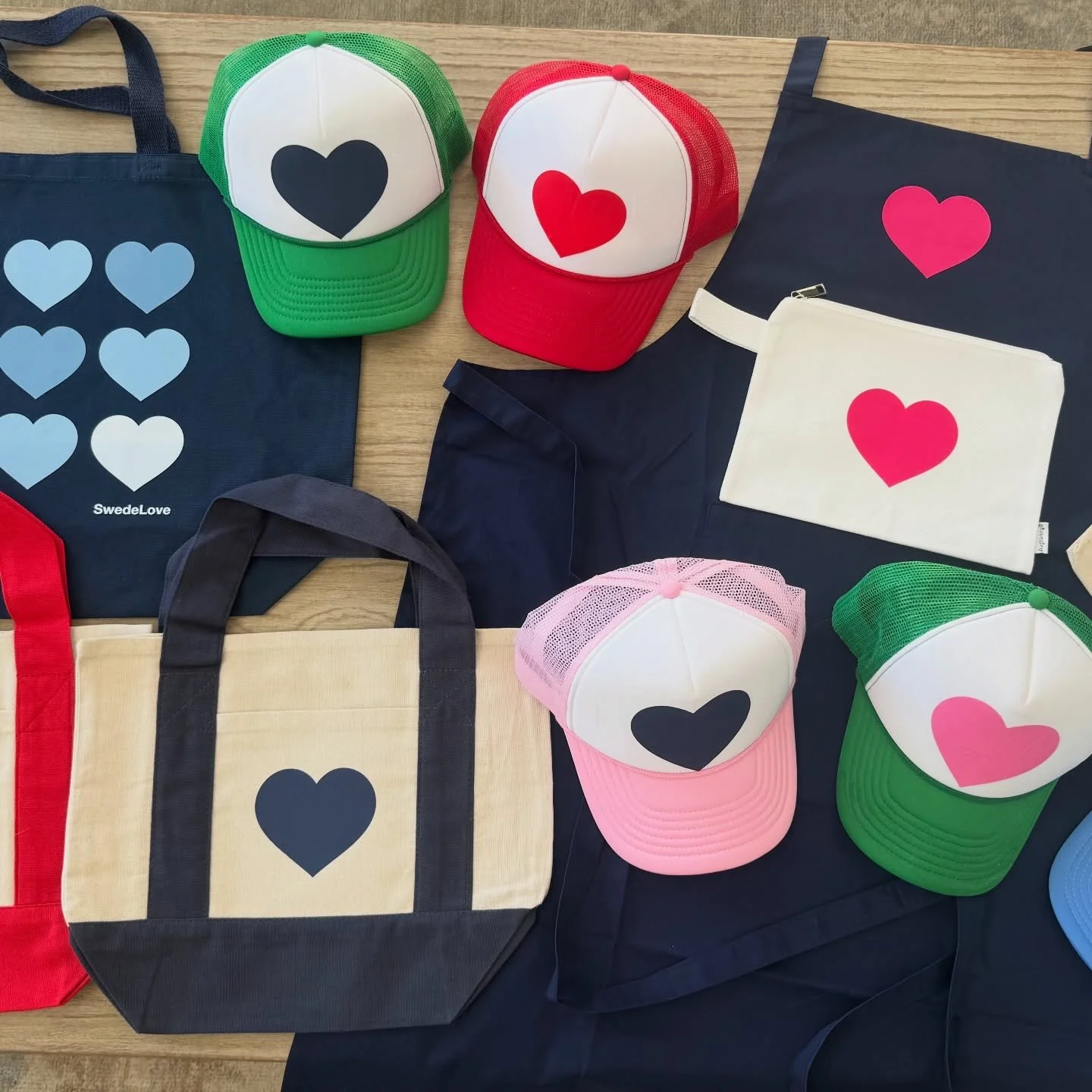 Introducing the SwedeLove Heart Collection! Hats. Sweatshirts.Totes. Aprons. Pouches. Everything you will need to wear your heart on your sleeve - or your head, your kitchen, your everything.  Perfect for Mother&rsquo;s Day gifting (or keeping it for