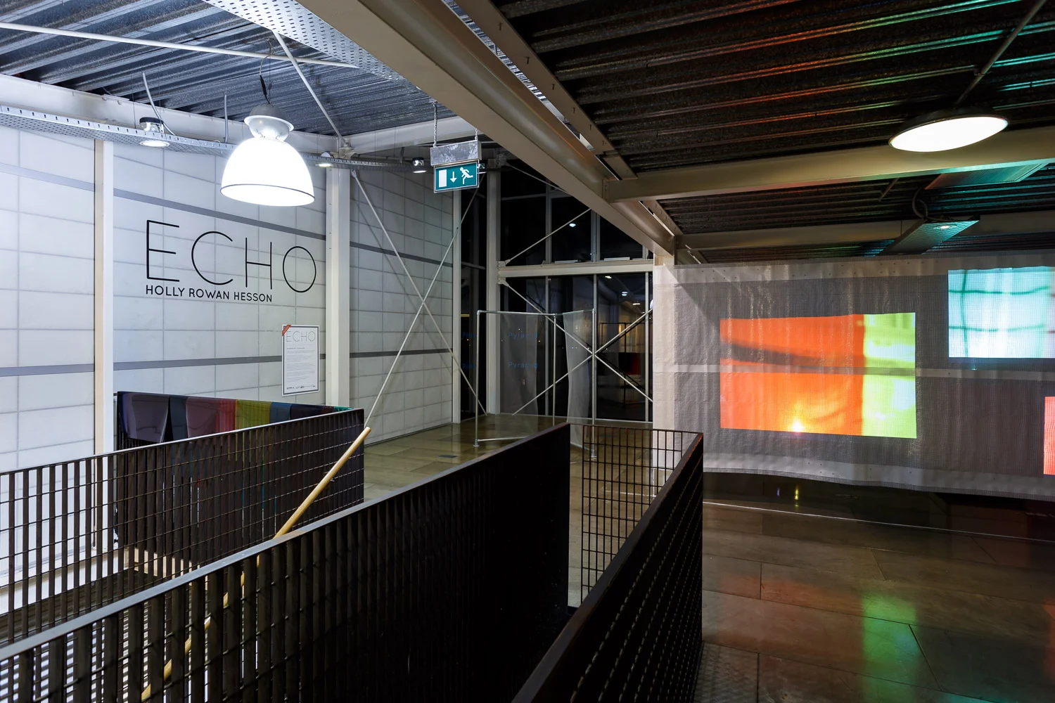 Holly Rowan Hesson , Echo (partial view), 2017, projection (140 photographs looped on six projectors), scaffold sheet, steel structure, webbing, lighting gels