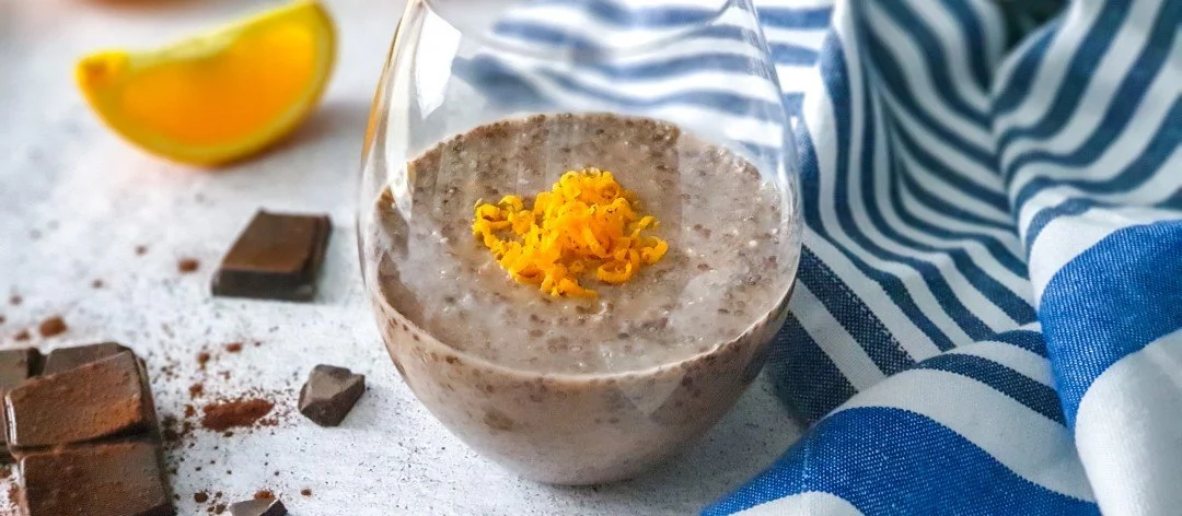 Glass jar of low FODMAP chocolate chia pudding.