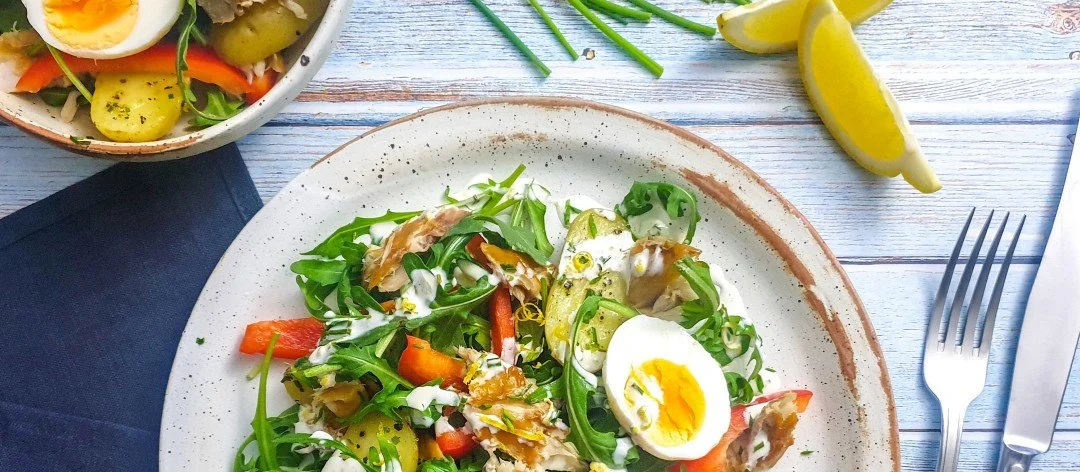 Bowl of low FODMAP smoked mackerel and potato salad.