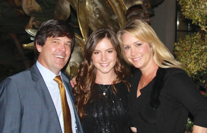 Sophomore psychology major Camille Jolly (center) smiles with her father, business law professor Cameron Jolly, and mother, business law professor Yvette Jolly.Photo courtesy Yvette Jolly.
