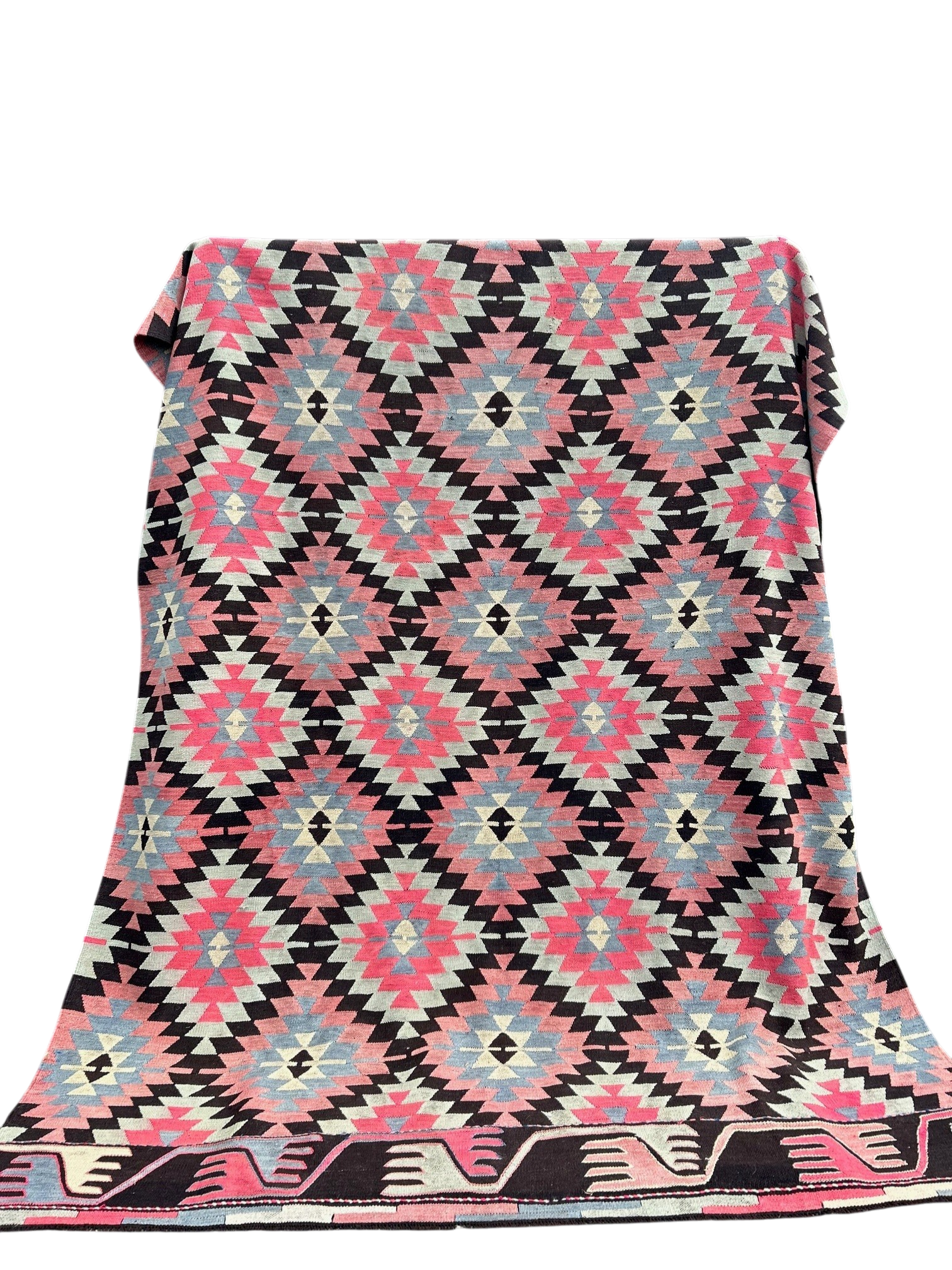 Turkish kilim outside warehouse cut out.png