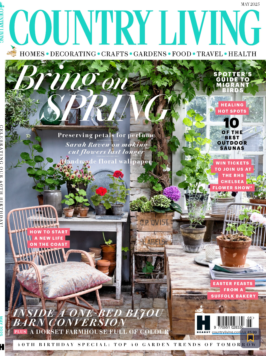Cover of Country Living magazine featuring a bright indoor gardening space with potted plants and flowers on rustic furniture, emphasizing spring-themed gardening and home decor.
