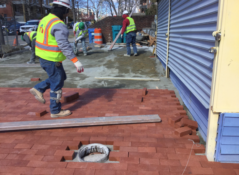 Contractor placing brick on brick sidewalk from Sta. 35+LT to 35+77 LT