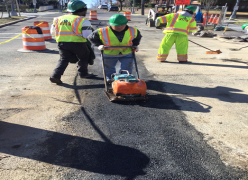 Asphalt placement on utility cut base from M-13 to M-16