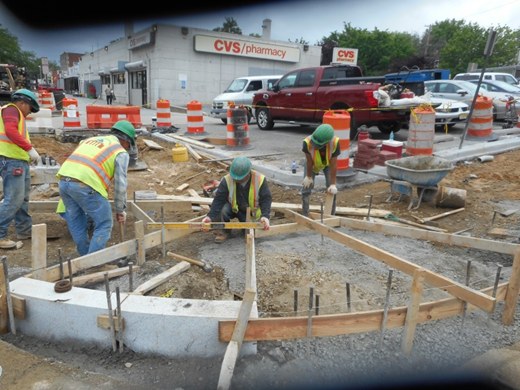 Forming ADA ramps at the south-east corner of 2nd St & Kennedy St