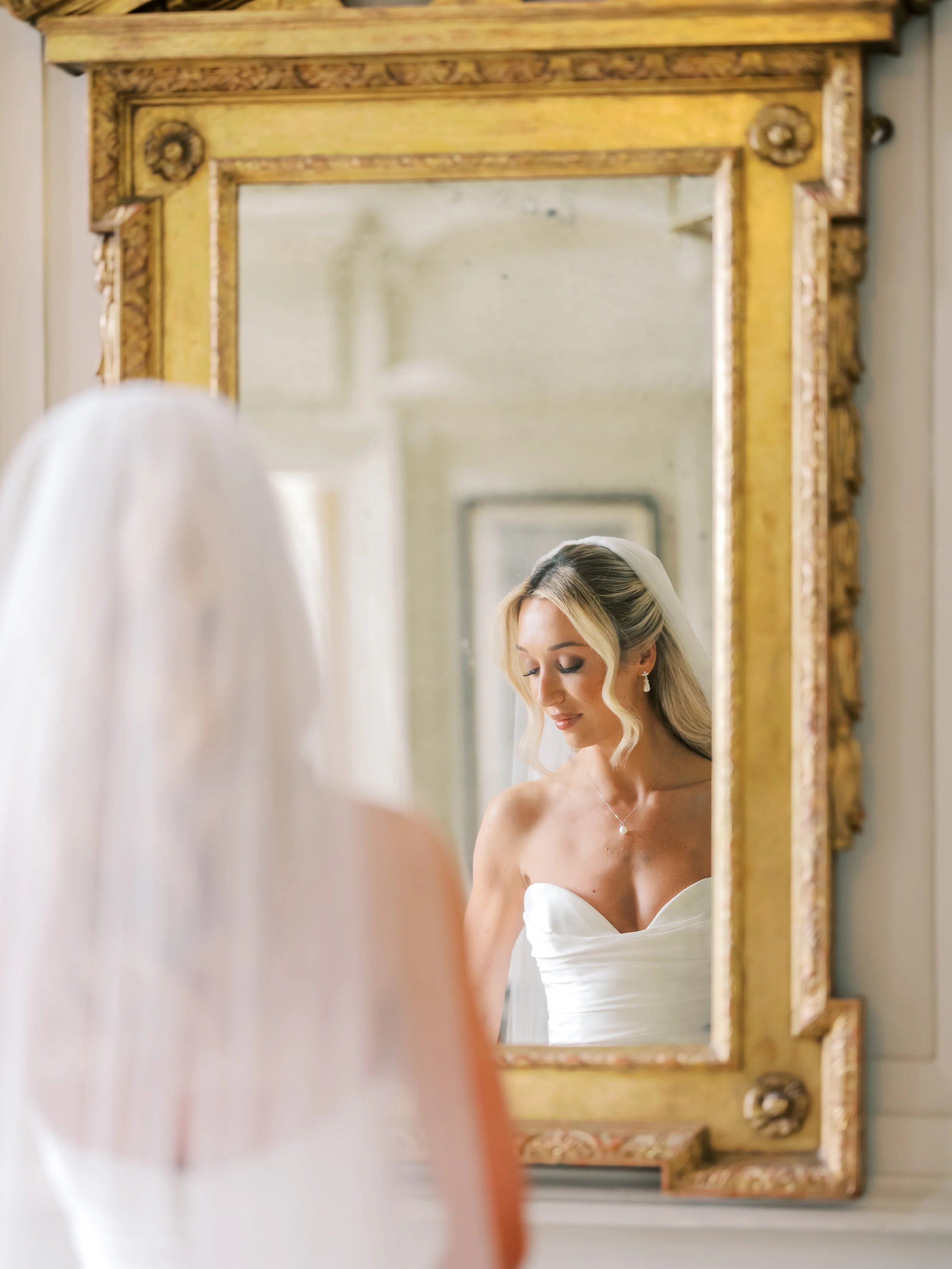 BRIDE IN MIRROR AT GLOSTER HOUSE EDITORIAL SHOOT