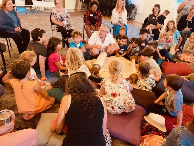Nitzanim kids gather round to see, touch, hear and talk about some Torah.