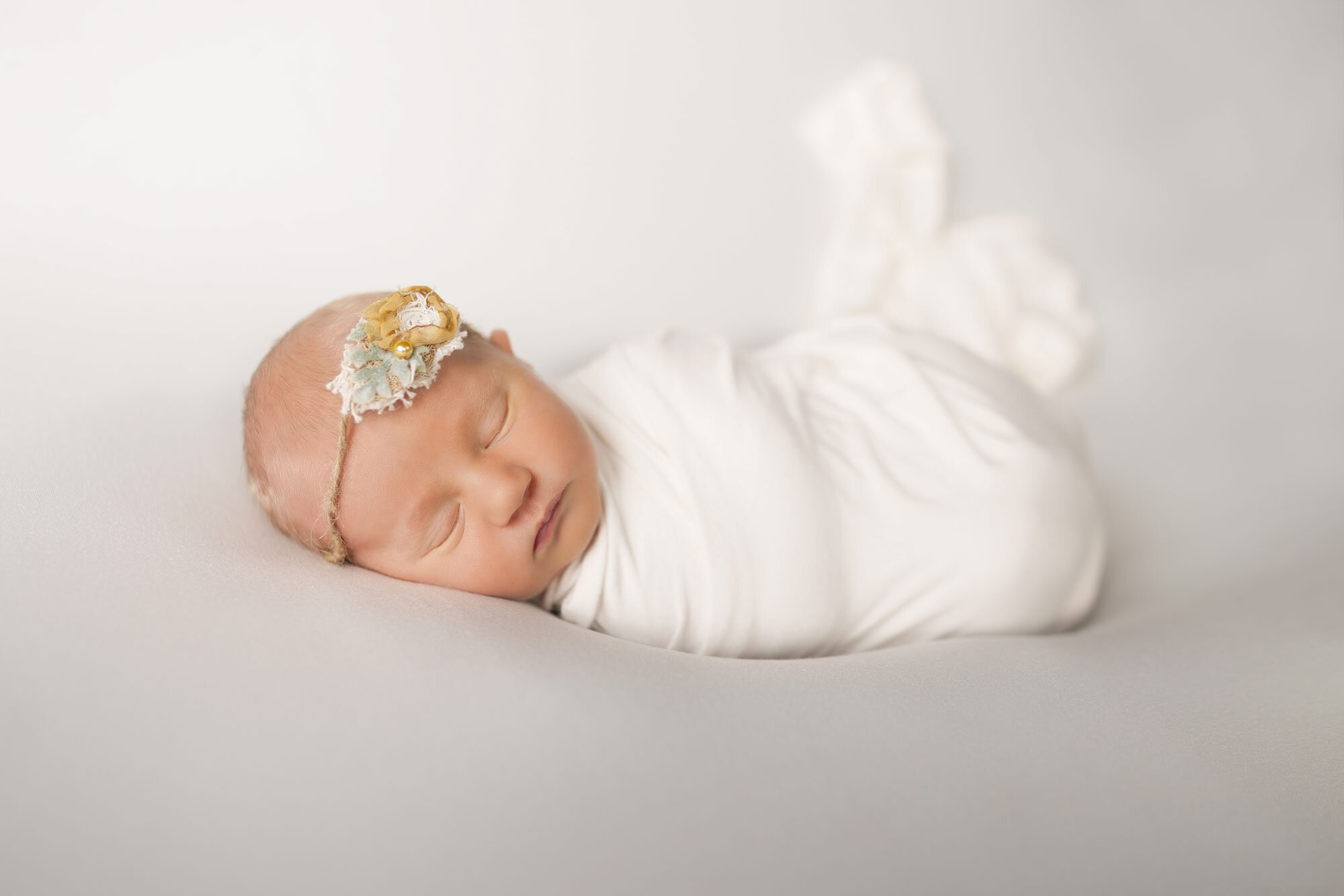 newborn baby girl with blanket best newborn photographer Asheville nc