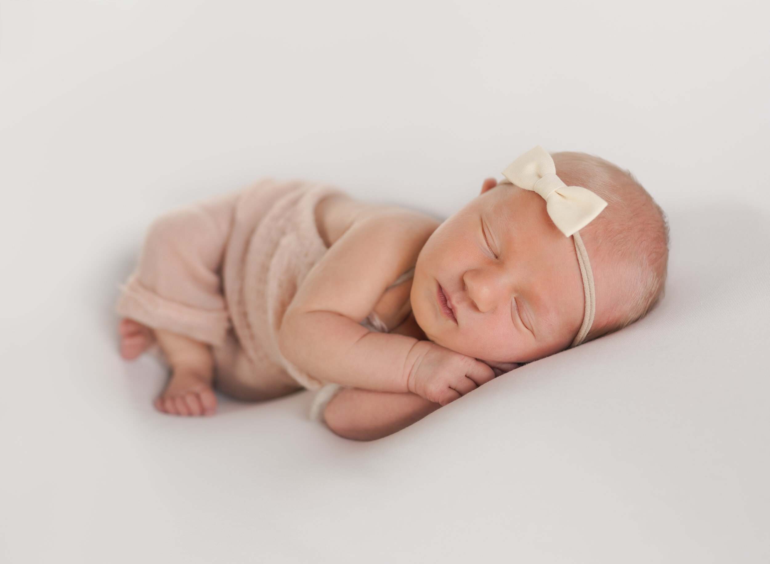 newborn baby in pink outfit Asheville Newborn Photographer