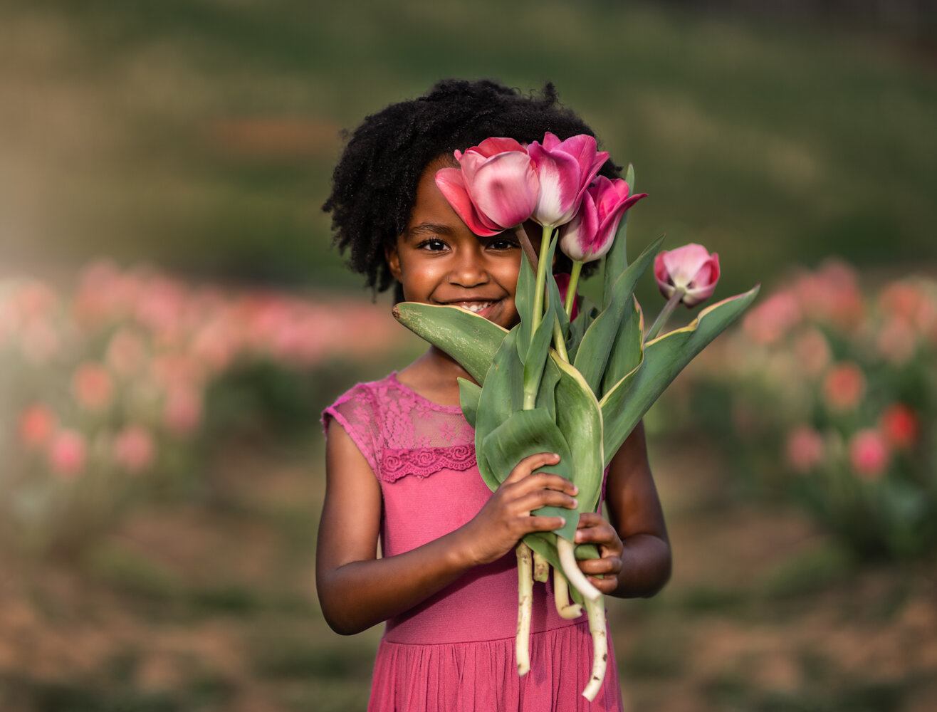 Little girl holding bouquet of tulips - Asheville's Best Photographer