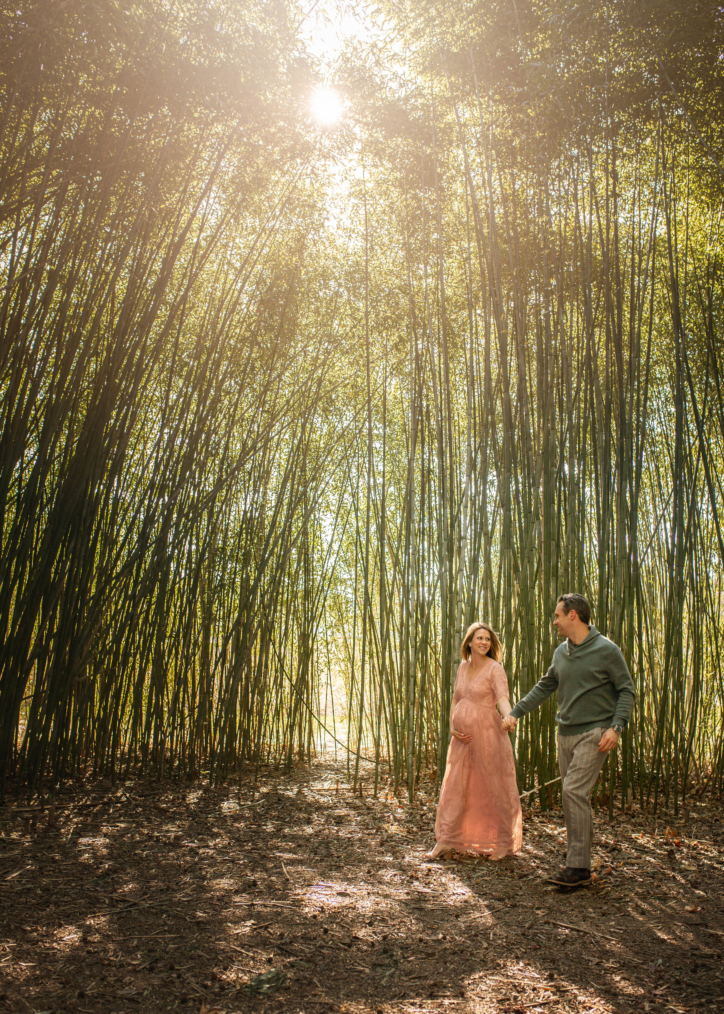 couple walking in a bamboo forrest Asheville family photographer