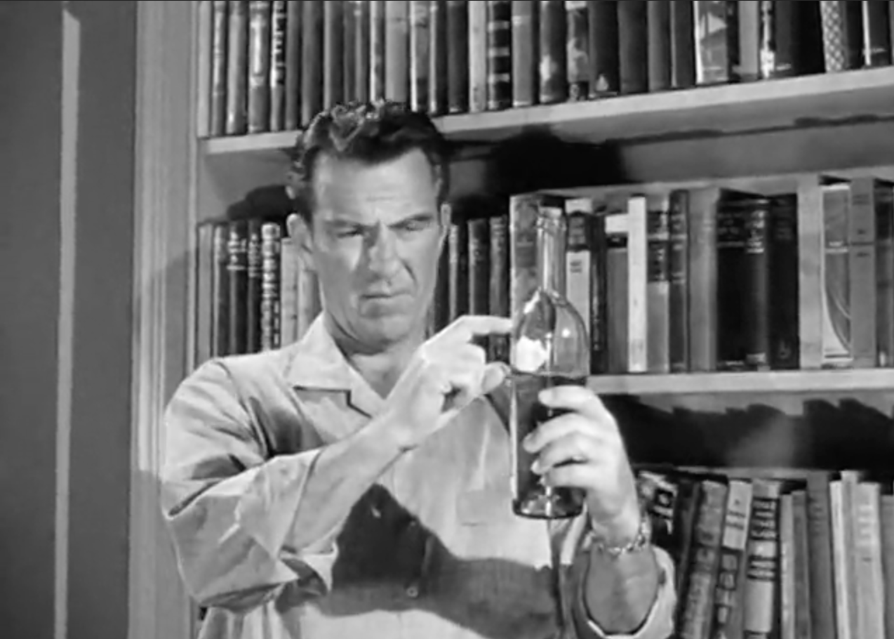Ward carefully measures the amount of missing brandy