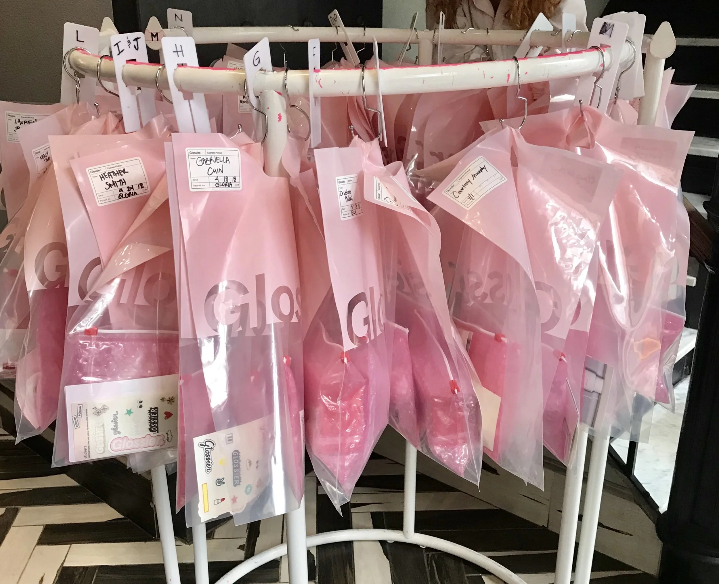 pink jumpsuit glossier