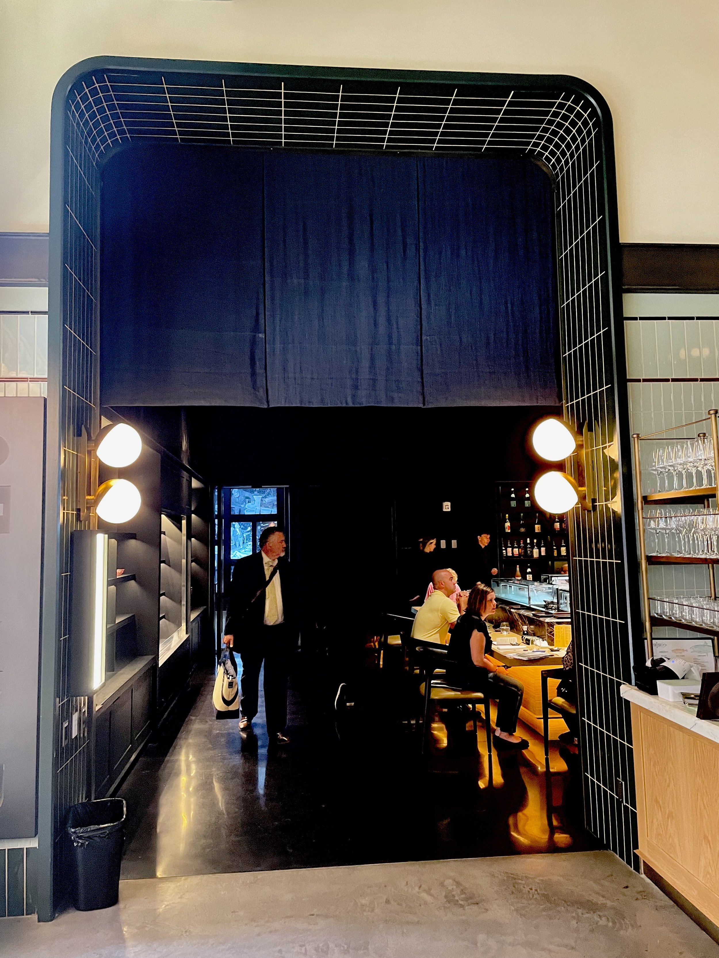 A look at the moody scene of the upstairs sushi bar