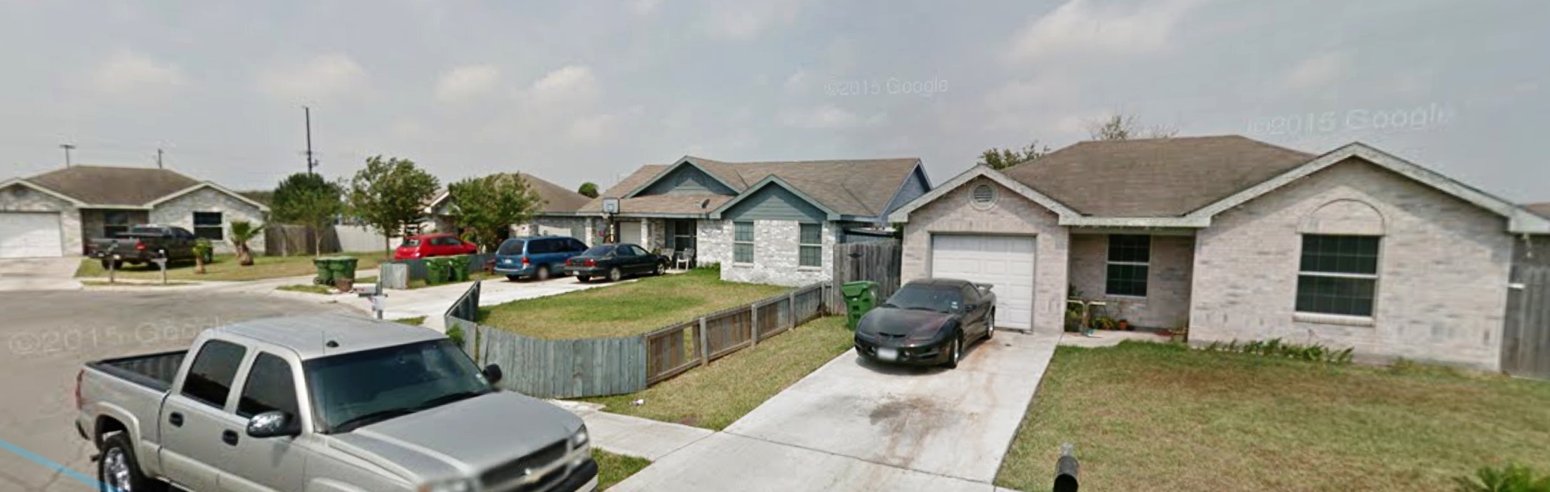  Jasmine says,&nbsp;"The tan house on the far right is the home I lived in at the time of the encounter. That window in the middle is where I looked through to see if the girl was still standing at the door. The house with the blue trim in the middle