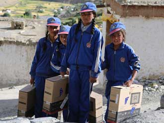 Locals in Nepal benefit from computers provided as part of the work done by Future Generations University . Photo: Future Generations University Website.