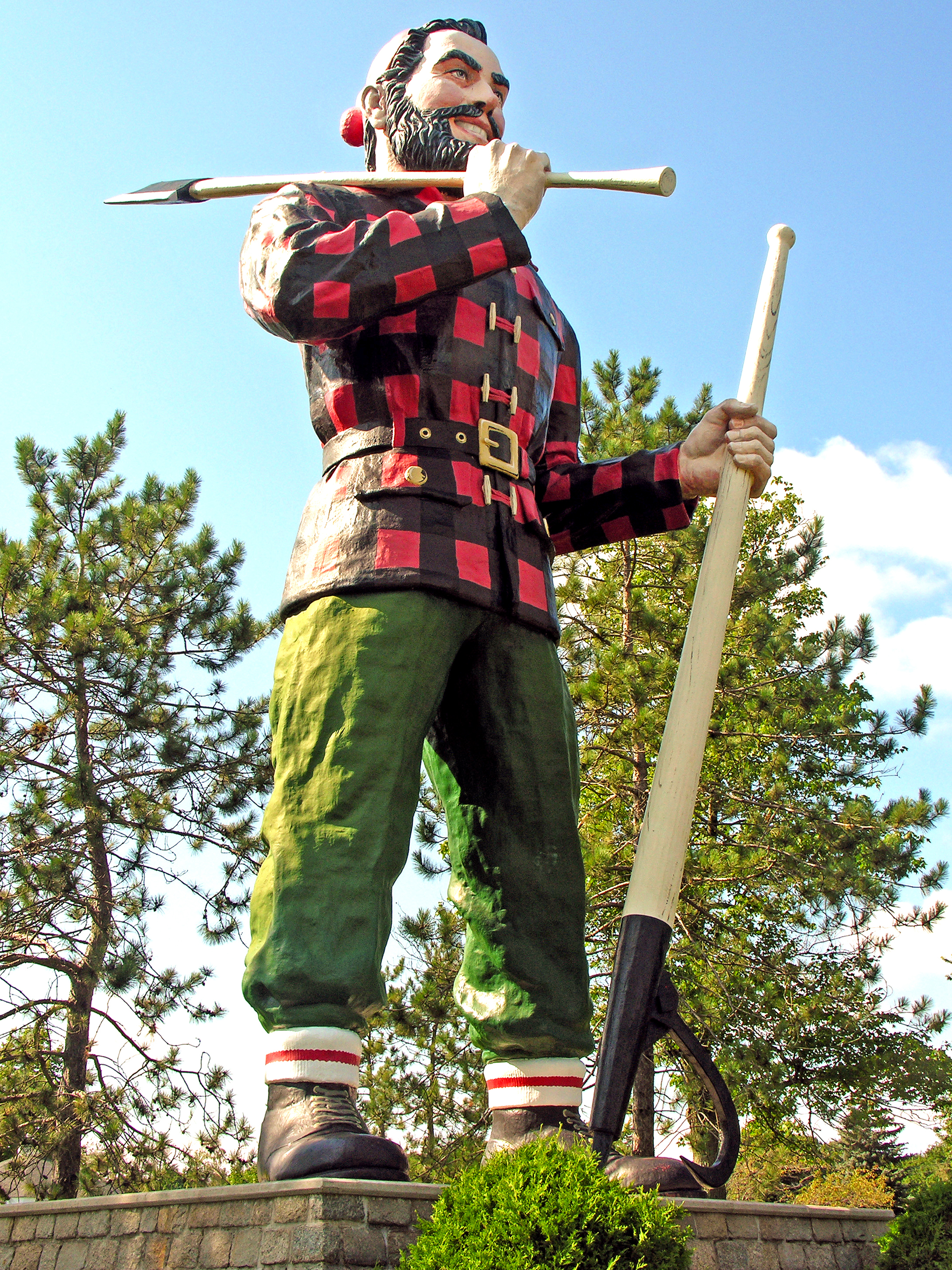  From  RoadsideAmerica.com : Bangor's Paul Bunyan, "Reputed to be the largest statue of Paul Bunyan in the world," according to its sign, stands on a stone pedestal in front of the Bangor Civic Center in Bass Park. The statue is 31 feet high and weig