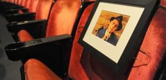 Merle’s favorite theater seat, where you can sometimes smell the aroma of fresh-brewed, Dark Roast coffee, if Merle’s spirit is seated there!