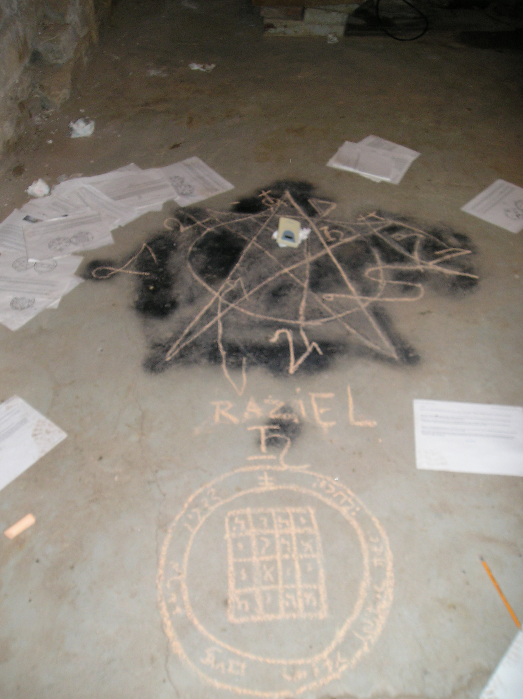  A demonologist’s attempt at retracing the pentagram that was left on the floor of the basement by a previous tenant, in order to determine what spells had been cast, and then adding some protective sigils in its place. 