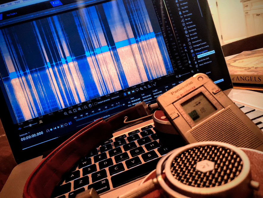  A screenshot of the Izotope audio clean-up Plug-in called “RX” and its visual waveform.  In the foreground is the Panasonic RR DR-60 digital audio recorder. 