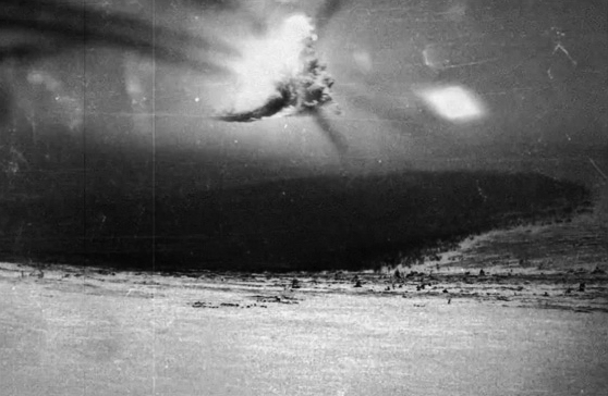  A photo that is often associated with the Dyatlov event but which researchers believe was not taken by anyone from the party. It appears to show an aerial explosion which might be connected to a military exercise taking place in the region, possibly