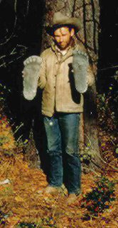  Roger Patterson shown with two plaster castings he took of “Patty’s” footprints at the Bluff Creek encounter site. 