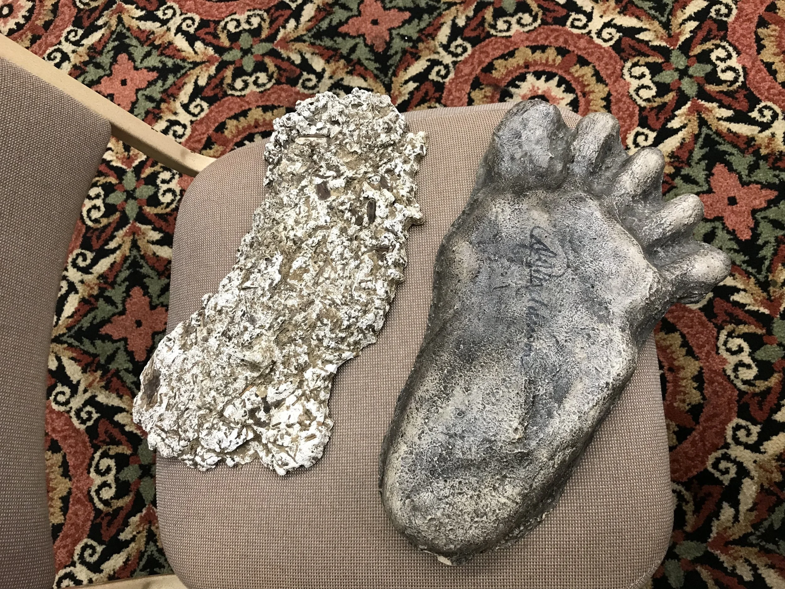 An actual Bigfoot cast alongside an original footprint cast copy that Jeffrey brought as props.