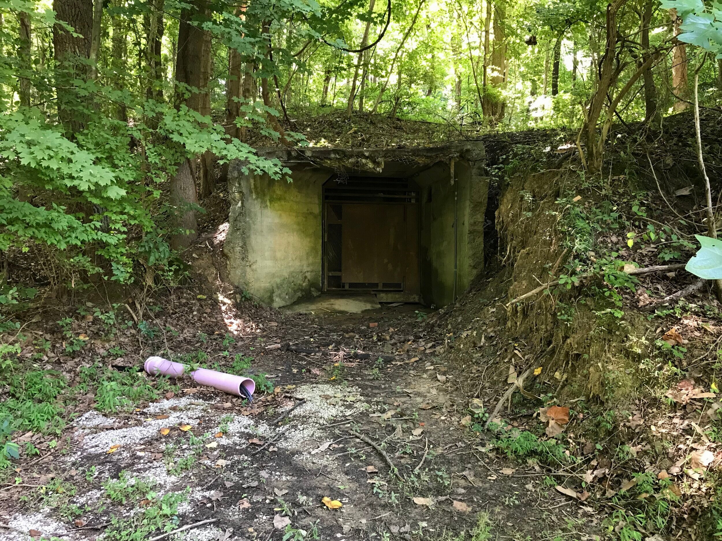  The ruins of the outside end of the “Death Tunnel” at the bottom of the hill, where supplies went up and deceased patients reportedly came down. 