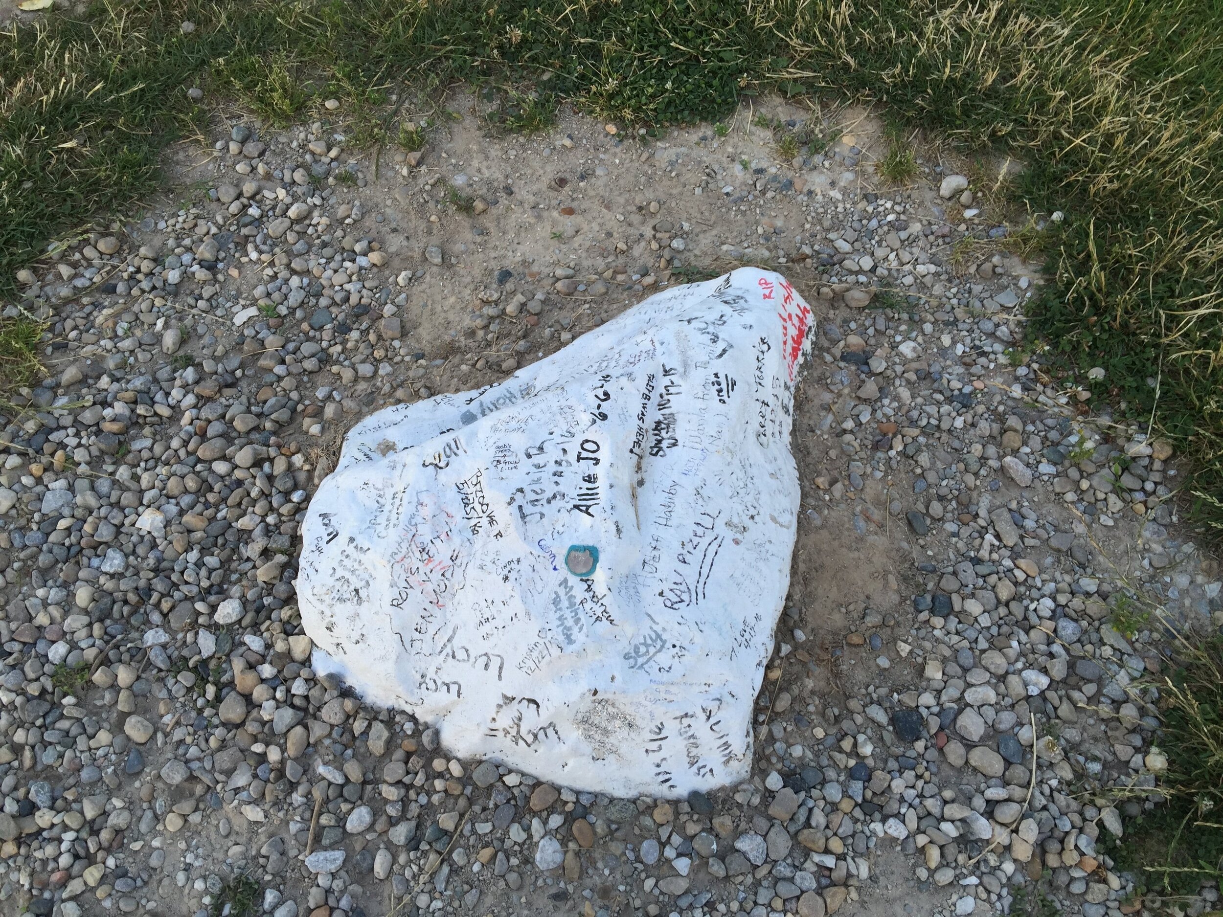  A rock near the headstone where well wishes are left by visitors. ©2016 Jill and Roger Pingleton 