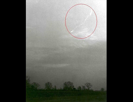  Photo showing the object's smoke trail over Royal Park, Michigan on December 9th, 1965 at 4:43 p.m. E.S.T. by Richard Champine, 2 miles east of Pontiac, Michigan. The photo was taken approximately 45 seconds after the fireball passed. 