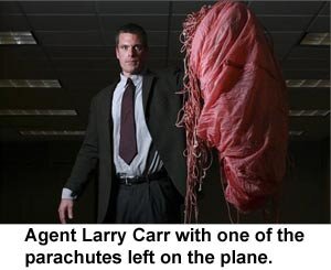 Larry Carr with leftover parachute.jpg