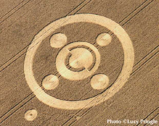  Brockwood Park, Hampshire, July 1995.  “A circle with two semi-circular paths inside it. Four outlying circles form a quintuplet with the inner circle and a ring surrounds the whole formation. A small circle lies outside the ring.” Photo: © Lucy Pri