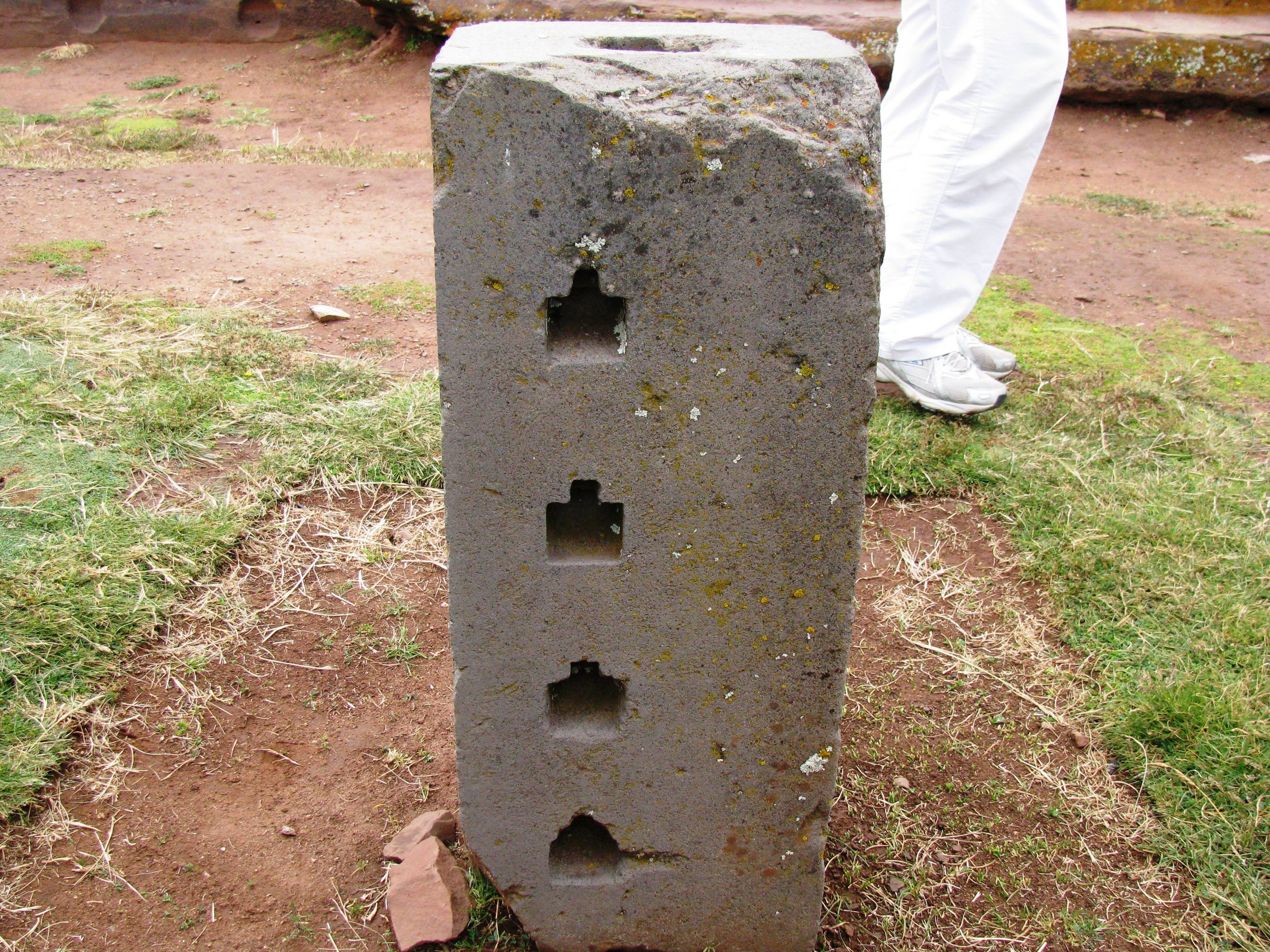  “Unfinished (upside down) block of andesite with  blind holes . On analog finished blocks, each blind hole houses a tiny T-cramp socket, proving that blocks of this type should be mated with others.”  By Brattarb - Own work, CC BY-SA 3.0 