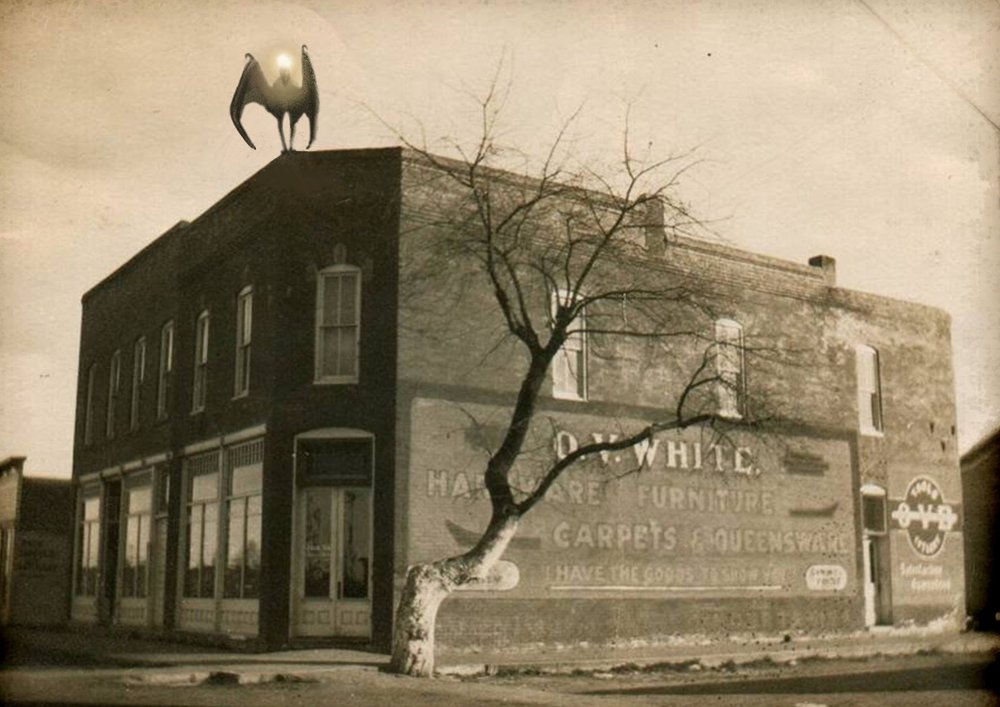  Artist’s conception of the Van Meter Visitor on top of Otto Vernin White’s hardware store, for the book cover of  The Van Meter Visitor , by Chad Lewis, Noah Voss, and Kevin Lee Nelson 