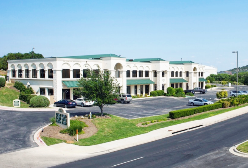 Our studio is located in the building facing the road, right next to Keller Williams. The building was originally the Lakeway Aquatic Center for reference.