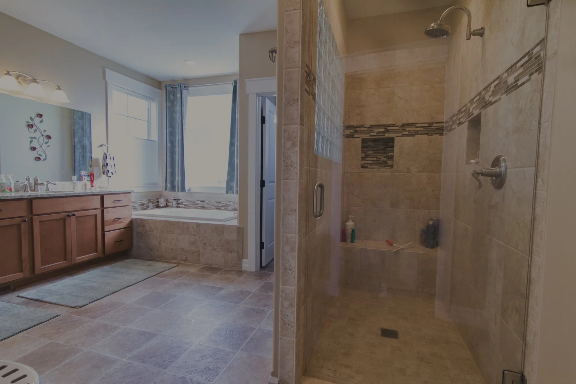 Dennis's custom home in Olympia featuring spa bathroom with stone accents and detached 4-bay shop - FoxHead Construction Thurston County