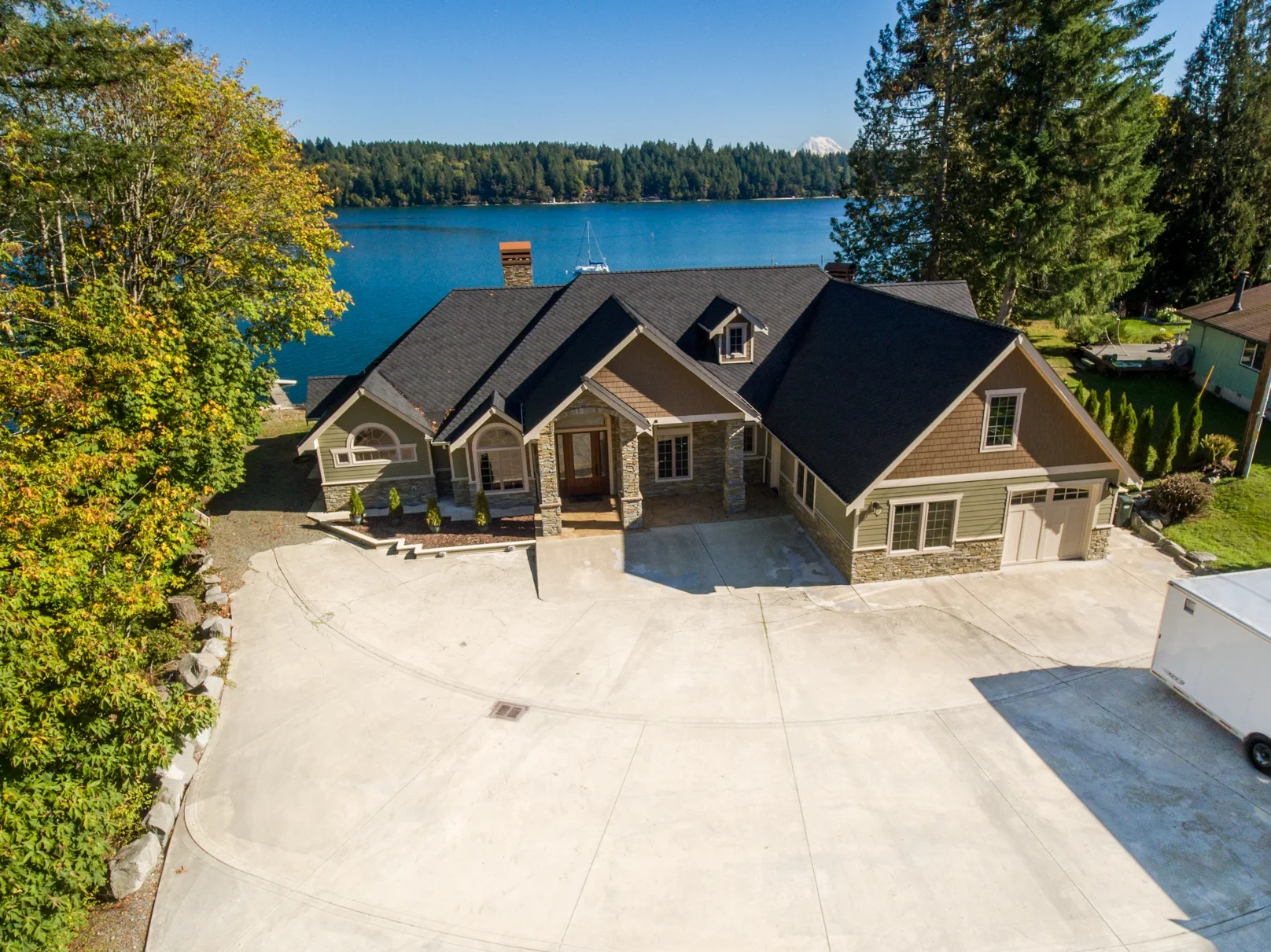Rod's custom waterfront home on Henderson Inlet with outdoor kitchen - aerial view - FoxHead Construction Thurston County
